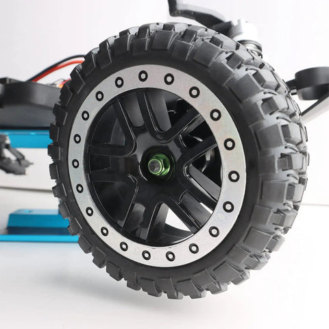 Close-up of RC car wheel with Eight Pack Flange M4 Nylon Lock Nuts With Serrated Edges in green