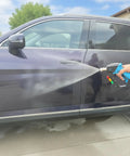 Beefed Up 5000 PSI Pressure Washer Gun With 360 Degree Swivel And Five Quick Connect Nozzles cleaning a car