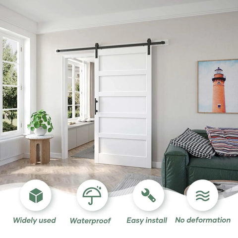 White 42x84 Inch Barn Door With 7 Foot Sliding Door Hardware Kit Included And Handle Solid Wood MDF And PVC Surface No Fuss DIY Assembly 5 Panel Design Fits 38 To 41 Inch Opening Waterproof And Scratch Proof installed in a living room setting