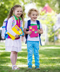 Children holding notebooks with 90Pcs Hibiscus Flower Name Tag Stickers Set With 9 Dope Styles Colorful Floral Blank Nameplates in a park.