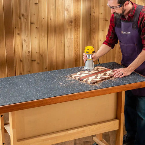 Man using a router on a Heavy Duty Rubber Workbench Mat 2x5 Feet for Woodworking, Garage, and Tool Benches, built tough and grippy.