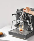 Alto Espresso Machine With Flow Control, Dual Boiler And PID For Precise Temperature in black being used to make espresso.