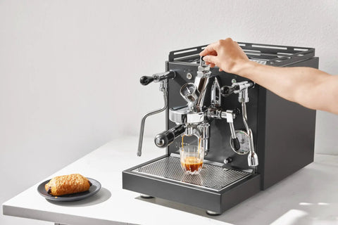 Alto Espresso Machine With Flow Control, Dual Boiler And PID For Precise Temperature in black being used to make espresso.