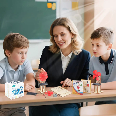 Six Solar Fan STEM Kits For Kids Ages Six To Twelve, Hands On Classroom Science Projects With Solar Panel, Motor, Blades, And Illustrated Instructions, Easy Assembly, Perfect For Learning Circuits And Solar Power. Classroom solar fan STEM kit with kids and teacher at table