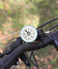 Round Orienteering Compass For Hiking And Camping, Handy Handheld Navigation Tool on bike handlebar outdoors