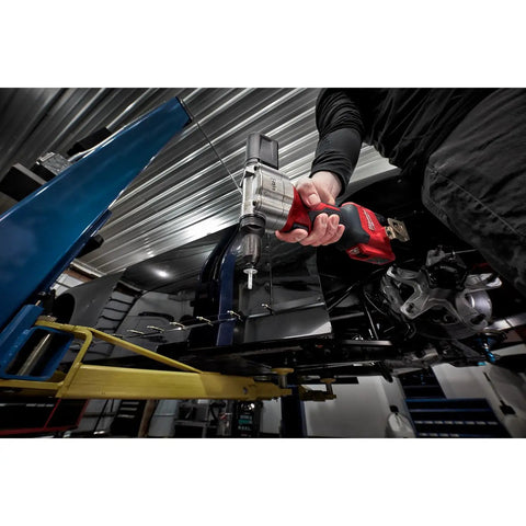 Milwaukee M12 Cordless Rivet Tool Bare Unit used to install rivets on metal frame in workshop setting.