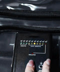Keep Static Outta Your Circuit Boards With This Antistatic Clear Crossbody Tool Bag featuring a multimeter monitor in use.