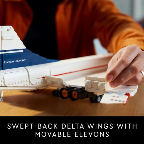 Person adjusting elevons on Iconic Concorde Model Aircraft Building Kit for Adults with realistic details and functional pieces.