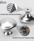 Close-up of Thirty Five Pack Brushed Nickel Cabinet Knobs 1-1/4 Inch Round Drawer Knobs with stainless steel top and zinc alloy base.
