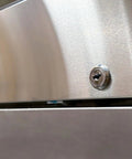 Close-up of the lock on a Commercial Three Door Reach In Freezer With Heavy Duty Stainless Steel Build ETL Certified.