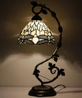 Amber Tiffany Style Dragonfly Table Lamp With Stained Glass Shade And Metal Leaf Base in bronze finish, illuminated