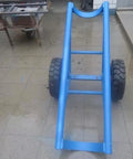 Tough As Nails Heavy Duty Pole Hauler Cart For Concrete Utility Lines And Long Material Transport With Swivel Casters And Bulletproof Steel Chassis Assembly showing blue steel frame and large tires.