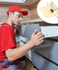 Installer fitting cabinet with Five Piece Dope Self Closing Cabinet Door Hinges Kit For RVs And Camper Cabinets Featuring 1/2 Design Semi Hidden Steel Hinges Easy Install Versatile Application Automatic Door Closer For Smooth Quiet Closures On RV Doors