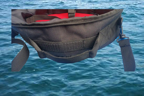 Close-up of a heavy duty padded scuba regulator bag with detachable shoulder strap or just carry handle over water background.