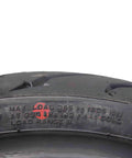 Close-up of tire tread and sidewall text on Pirelli Angel ST Front And Rear Sport Touring Motorcycle Tires For Max Grip Durability And Stability On Dry Wet And Cold Roads Fits Sport And Touring Bikes