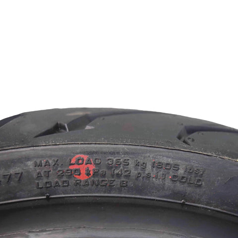 Close-up of tire tread and sidewall text on Pirelli Angel ST Front And Rear Sport Touring Motorcycle Tires For Max Grip Durability And Stability On Dry Wet And Cold Roads Fits Sport And Touring Bikes