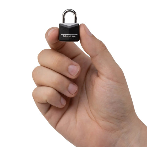 Hand holding a small padlock with covered aluminum body and steel shackle three quarters inch wide indoor use daily carry.