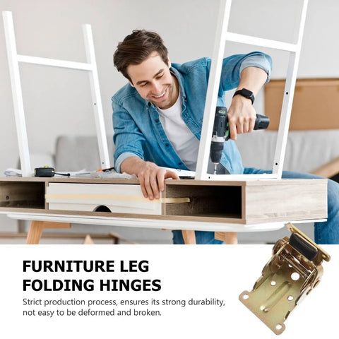 Man assembling desk with 4 Pack Folding Bed Leg Brackets With Spring Lock Self Locking Hinges For DIY Beds And Folding Workbenches Heavy Duty SPCC Metal Furniture Leg Supports 0 Or 90 Degree Lock And Easy Fold Unfold visible