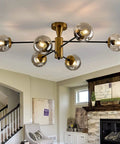 6-Light Sputnik Gold Ceiling Light Fixture With Glass Globe, Semi-Flush Mount, Mid-Century Chandelier in a living room setting