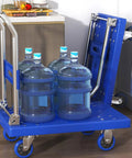 Rock Solid Heavy Duty Folding Platform Truck Rated For One Hundred Fifty Kilos With Four Smooth Rolling Wheels Featuring An Adjustable Push Handle And Quick Fold Deck, transporting large water bottles.