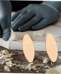 Heavy Duty Maple Wood Joiner Biscuits 100 Piece Pack Smooth Domino being used on furniture with glue in a woodworking setting.
