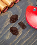 20 Pack Plastic Ball Catch Latches For Cabinets And Cupboards on wooden surface with red tool nearby