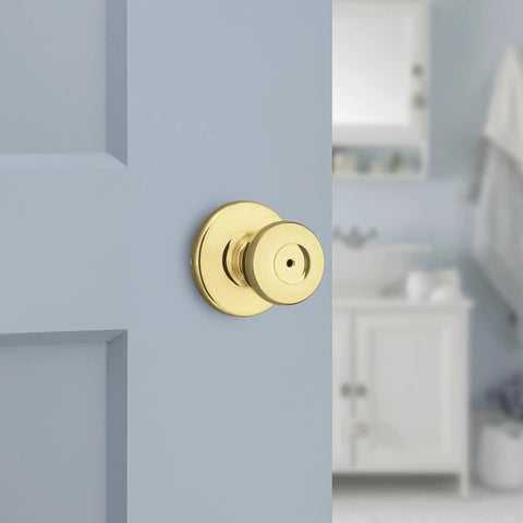 Mobile Home Privacy Door Knob With Lock For Bedroom And Bathroom, Interior Door Handle In Polished Brass shown on blue door.