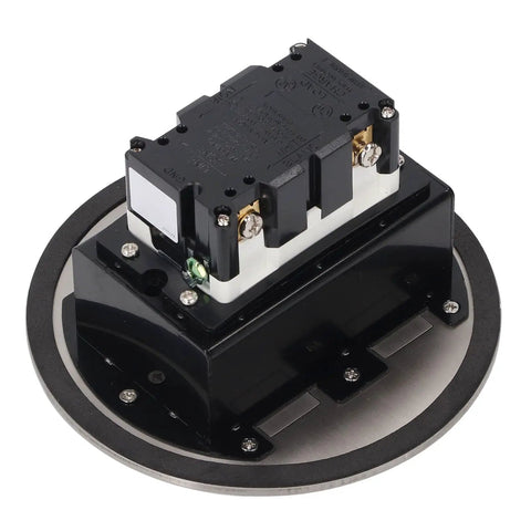 Rock Solid Round Recessed Floor Outlet Kit Featuring Heavy Duty Stainless Steel Case And Dual 20A Three Prong Electrical Sockets top view of the socket