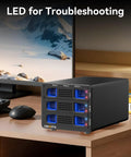 Beefy Hybrid Storage Rig Housing Two Sata Drives Alongside Triple M.2 NVMe Slots With Flexible Raid Configs Built In Silent Fan And Super Fast Dual USB 3.2 Ports For Max Capacity Setup on a desk with LED status indicators.