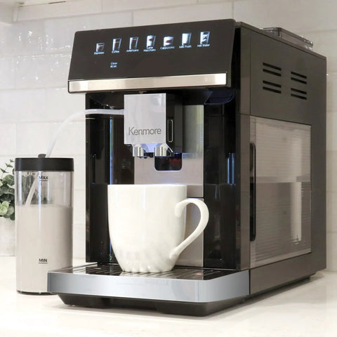 Heavy Hitter Fully Automatic Espresso Maker Featuring Bright Color Touchscreen with white cup and integrated milk frother.
