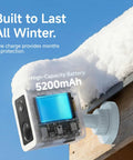 Piece Of Cake Setup Brings You Crisp 2K Wireless Security Coverage With Quick Stick Magnetic Mount, Wifi 6 Dual Band, Full Color Night Vision, IP66 Weatherproof Build, Straight Shooter Two Way Audio, Snappy Motion Alerts, And Long Haul Battery showcasing the battery and mounted camera in snow.