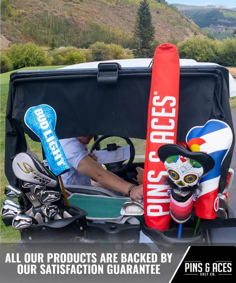 Golf cart with customizable headcovers and accessories on a course, promoting Pins & Aces branding and satisfaction guarantee.