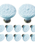 12 Pcs Sky Blue Ceramic Cabinet Knobs featuring floral design, 34mm round, ideal for kitchens and baths, includes installation hardware.