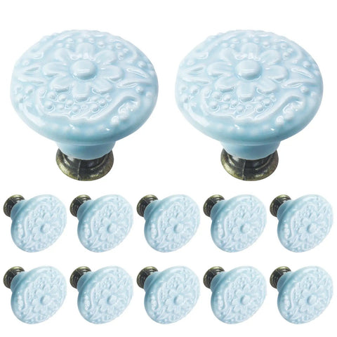 12 Pcs Sky Blue Ceramic Cabinet Knobs featuring floral design, 34mm round, ideal for kitchens and baths, includes installation hardware.