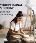 Woman crafting beside Natural Daylight Floor Lamp With Adjustable Gooseneck For Reading Crafting And Sewing A 6400K Task Light