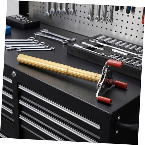 No Sweat Smoke Sensor Removal Tool With Slick Aluminum Extension Pole displayed on a tool bench, ideal for high ceiling installations.
