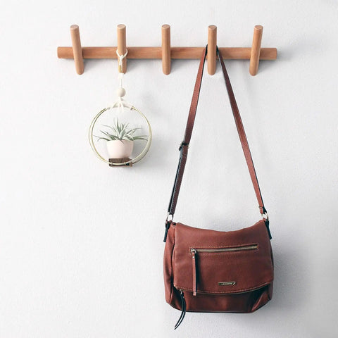 Wall Mounted Coat And Hat Rack With Five Hooks In Beautiful Wood Finish For Entryway Hallway Or Bedroom No Fuss Easy Setup Durable Robe Rack With Classic Design, holding a handbag and hanging decor.