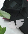 50 Piece Pvc Butterfly Collar Stays Double Layer Shirt Inserts placed on a black shirt for a polished look.