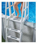 Person stepping onto pool ladder with Grippy Anti Slip Tape For Wet Areas 2 Inch By 15 Feet Clear Self Adhesive Backing