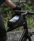 Cyclist using a Waterproof Bike Frame Bag With 1.6L Capacity Front Phone Holder And Touchscreen Window Rain Cover in the rain.
