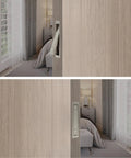 Pocket Door Pull Handle For Flush Mount Sliding Doors In Brushed Nickel Finish, low profile, installed on wood door, bedroom view.