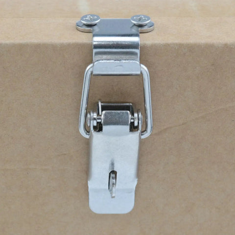 Beefy Heavy Duty Stainless Steel Toggle Latch Set For Cabinets And Boxes 90 Degree Box Latch Hardware mounted on cardboard surface