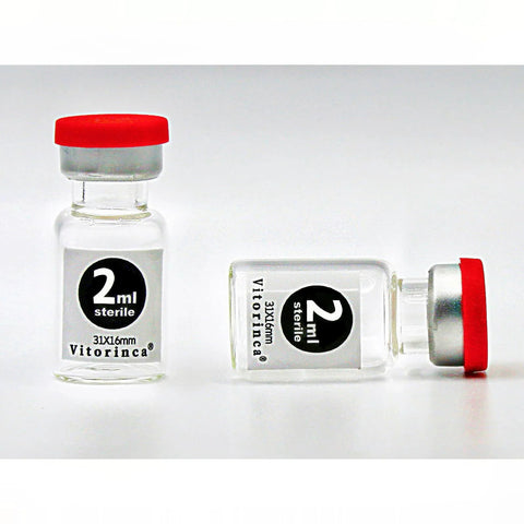 Two 2 ml sterile glass vials with red caps; one upright and one on its side, label reads 2 ml sterile (Vitorinca)