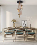 Sleek Three Light Solid Wood Pendant Lamp With Energy Saving Led Fixtures Postmodern Minimalist Hanging Drop Light illuminating a modern dining room.