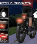 Rear view of Beast 6000W Dual Motor Ebike for Adults with safety lighting systems in action on an off-road path at night