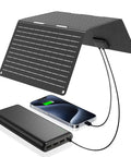 30W Portable Solar Panel Charger With All In One Foldable Tri Fold Design USB C And USB A ETFE IP67 Waterproof Ultra Light At 2 Lbs Powers Phones iPhone iPad Galaxy LG And Power Banks For Camping And Outdoor Travel, showing setup with phone and power bank