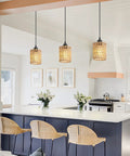 Straight Up Chic Boho Lighting Vibe For Your Sweet Space Featuring This Super Bright 3 Pack Woven Rattan Pendant Fixture with round shades above a kitchen island.