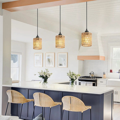 Straight Up Chic Boho Lighting Vibe For Your Sweet Space Featuring This Super Bright 3 Pack Woven Rattan Pendant Fixture with round shades above a kitchen island.