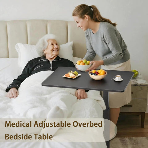 Mobile Standing Desk With Wheels Height Adjustable Pneumatic Laptop Desk used as overbed table in bedroom scene.