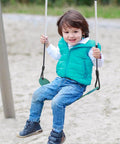 Child on playground swing, part of Two Pack Heavy Duty Swing Seat Supports 330 Pound Capacity For Backyard Garden And Playground EVA Non Slip Construction Tough As Nails Built To Last 26 Inch Long By Five Point Five Inch Wide Two Inch Thick Durable Swing Set Accessory.